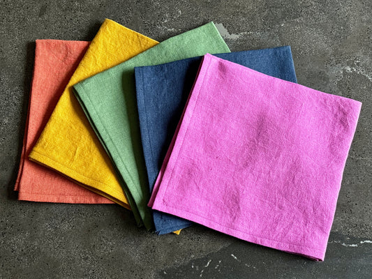 Five different-colored napkins